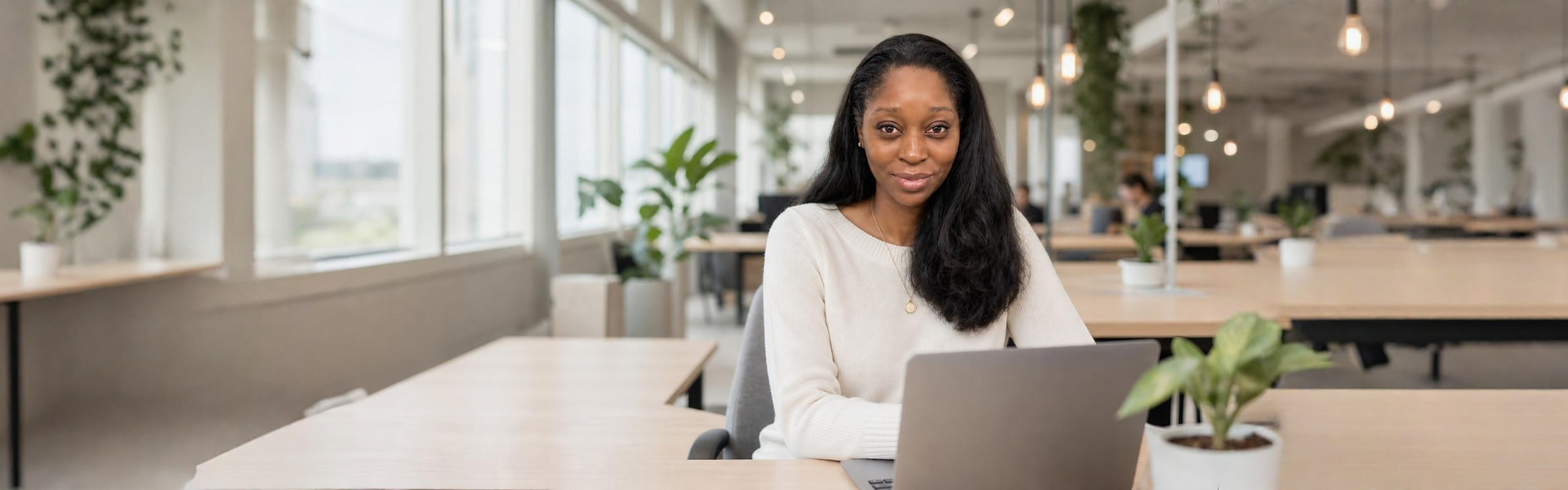 Shannon D. Smith working at her desk in a bright modern office
